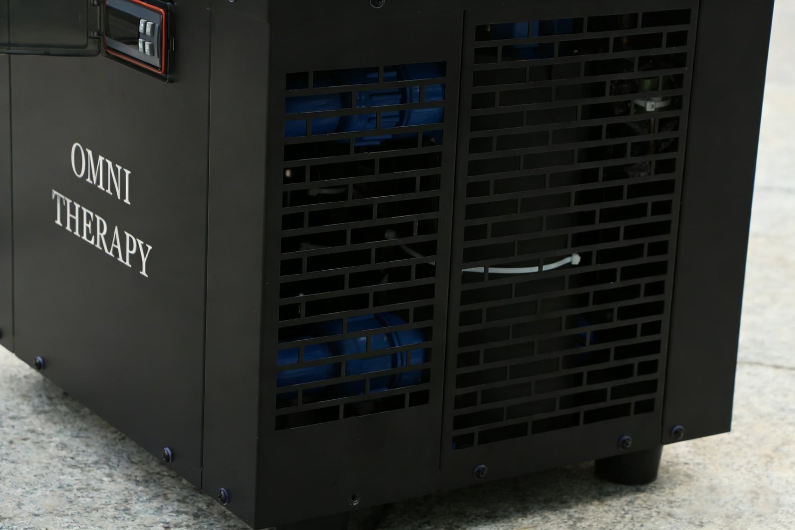 Cold plunge chiller heat rejection hardware behind an OMNI ventilation grille