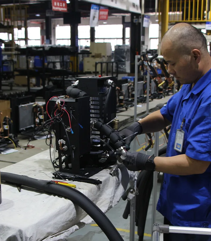 Close-up of a technician installing components inside a cold plunge chiller unit