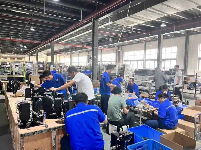 Workers assembling cold plunge chillers on the OMNI Ice factory floor