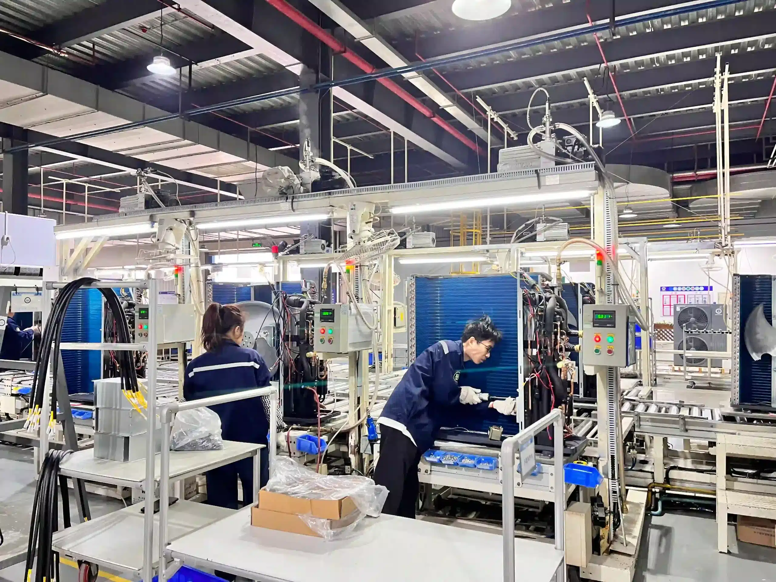 Factory technicians assembling recovery equipment on the production line