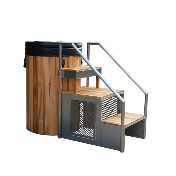 Angled view of a metal ice bath tub with wooden steps and stainless steel handrails, outdoor cold plunge barrel for recovery