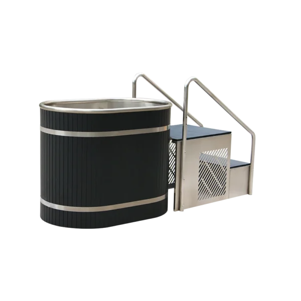 Angled view of metal tub for ice baths, featuring black barrel, stainless steel accents, and integrated entry steps