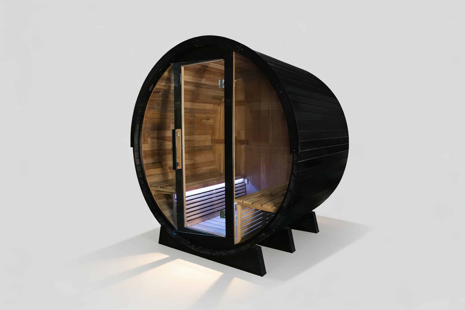 Traditional outdoor barrel sauna with panoramic rear window, weather-resistant cedar wood construction for garden spas and eco-friendly backyard retreats.