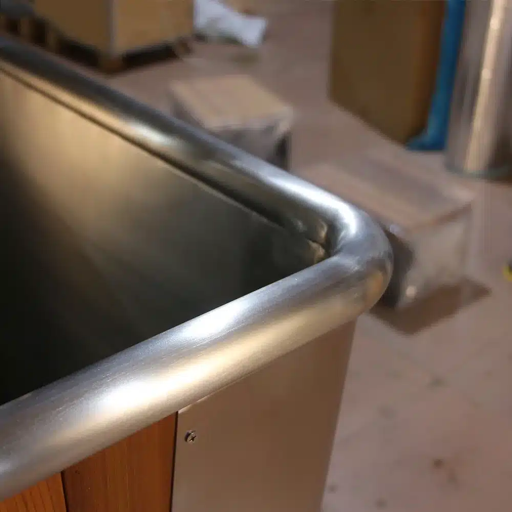 Close-up of the rolled stainless steel tub rim