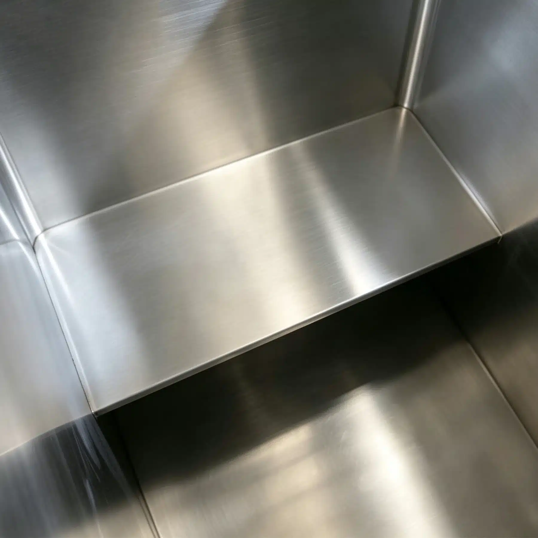 Close-up of stainless steel liner corners and weld finish