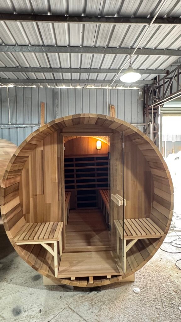 Real red cedar outdoor barrel sauna kit front porch assembly in workshop