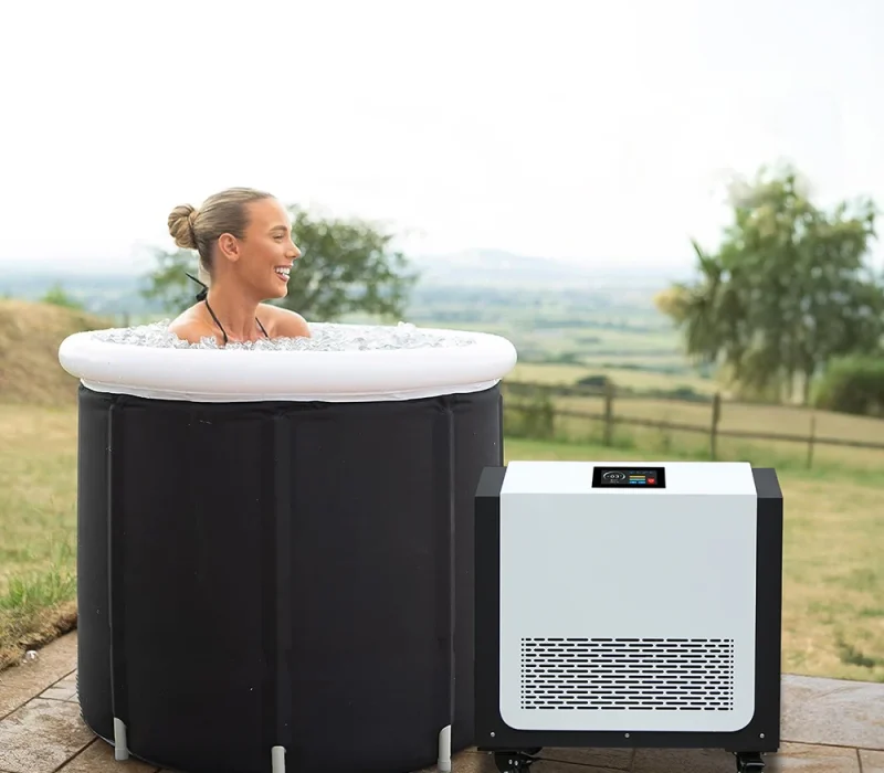 OMNI Therapy chiller system shown connected to a standard bathtub, demonstrating home-use compatibility for 0°C cold therapy